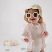 little girl wearing sunglasses and hat
